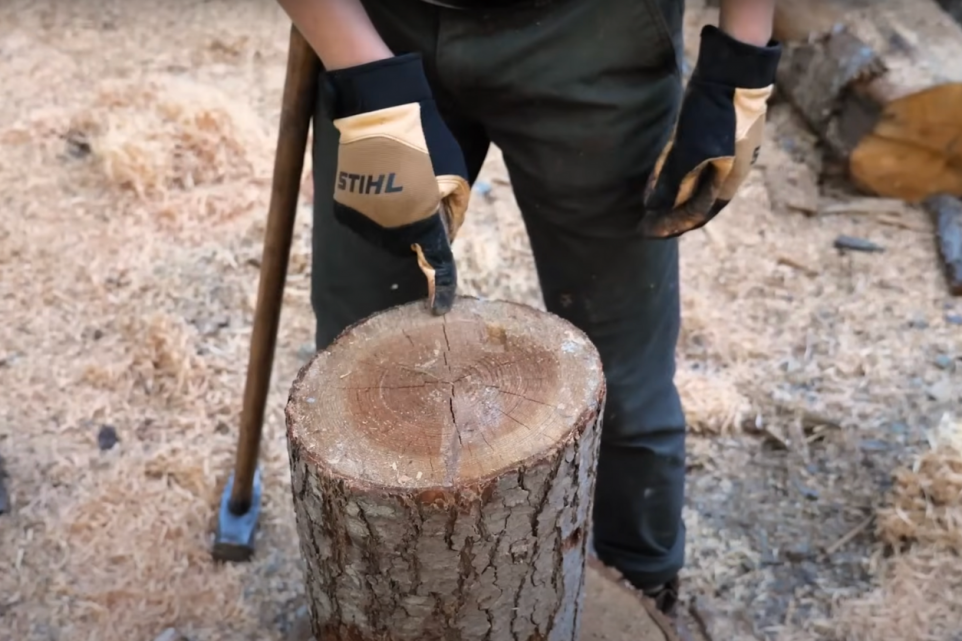 Splitting Wood With Axe